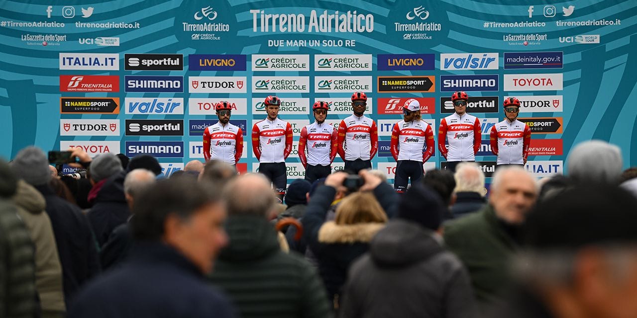 Riders pose at the finish line of the Tirreno Adriatico 2025