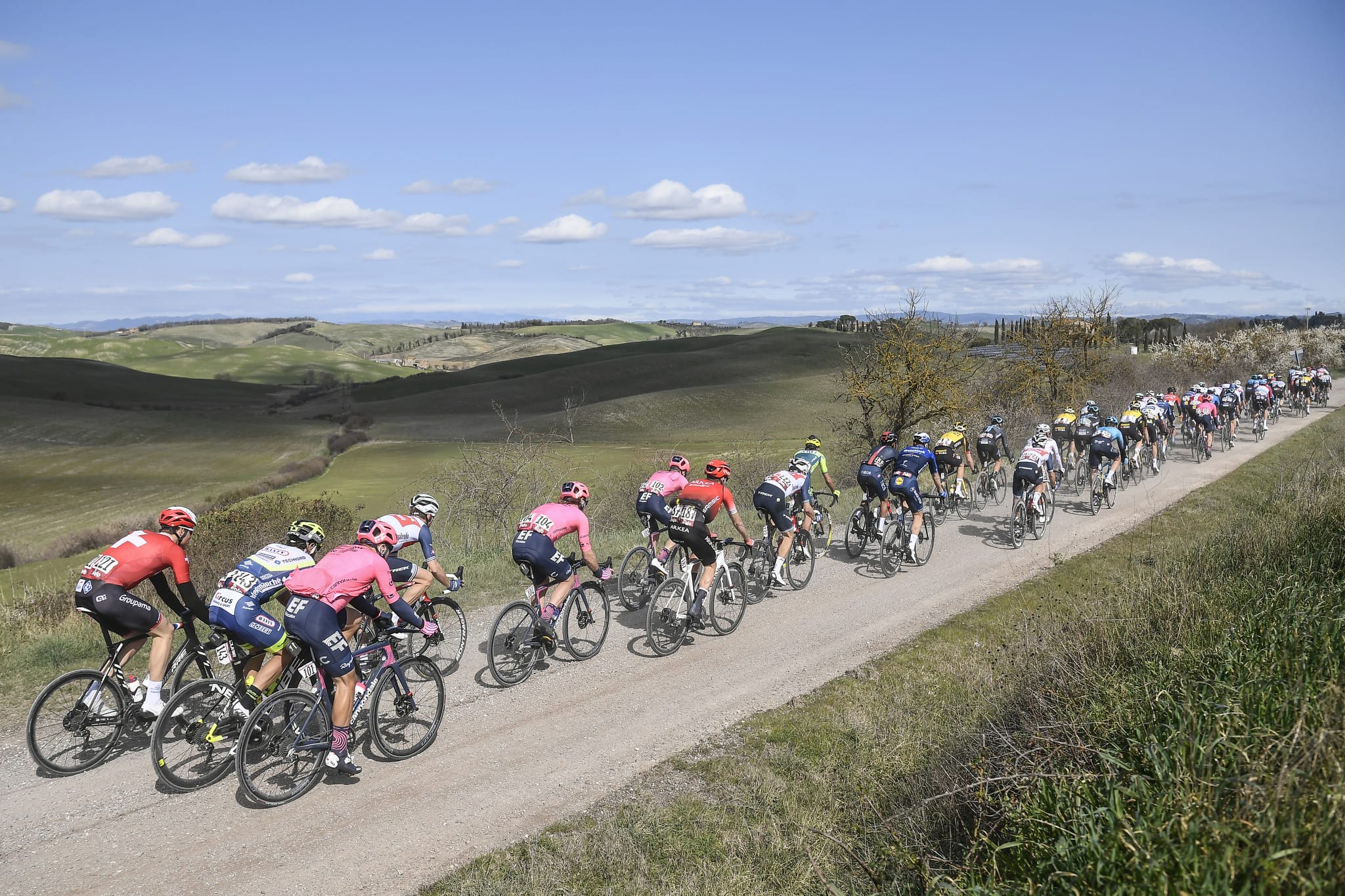 Peloton taking part in the Strade Bianche watch with Sportive Breaks