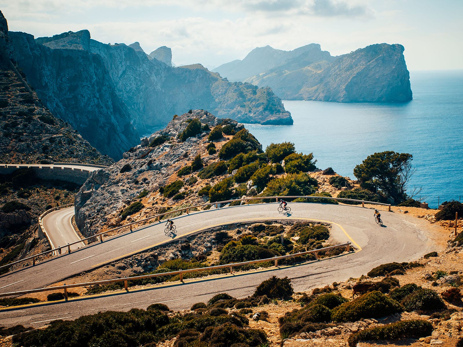 Riders tackle a tough climb and tricky hairpin during the Mallorca Cycling Week