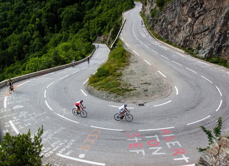 Cyclists negotiate a hairpin during the Alpe d'Huez Weekender