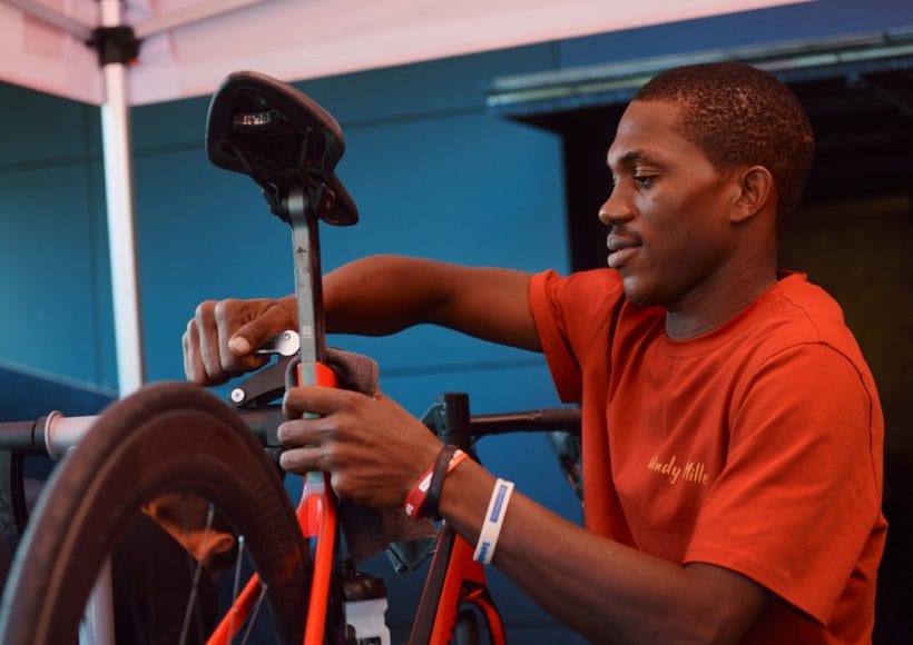 A mechanic fixes a bike during La Marmotte