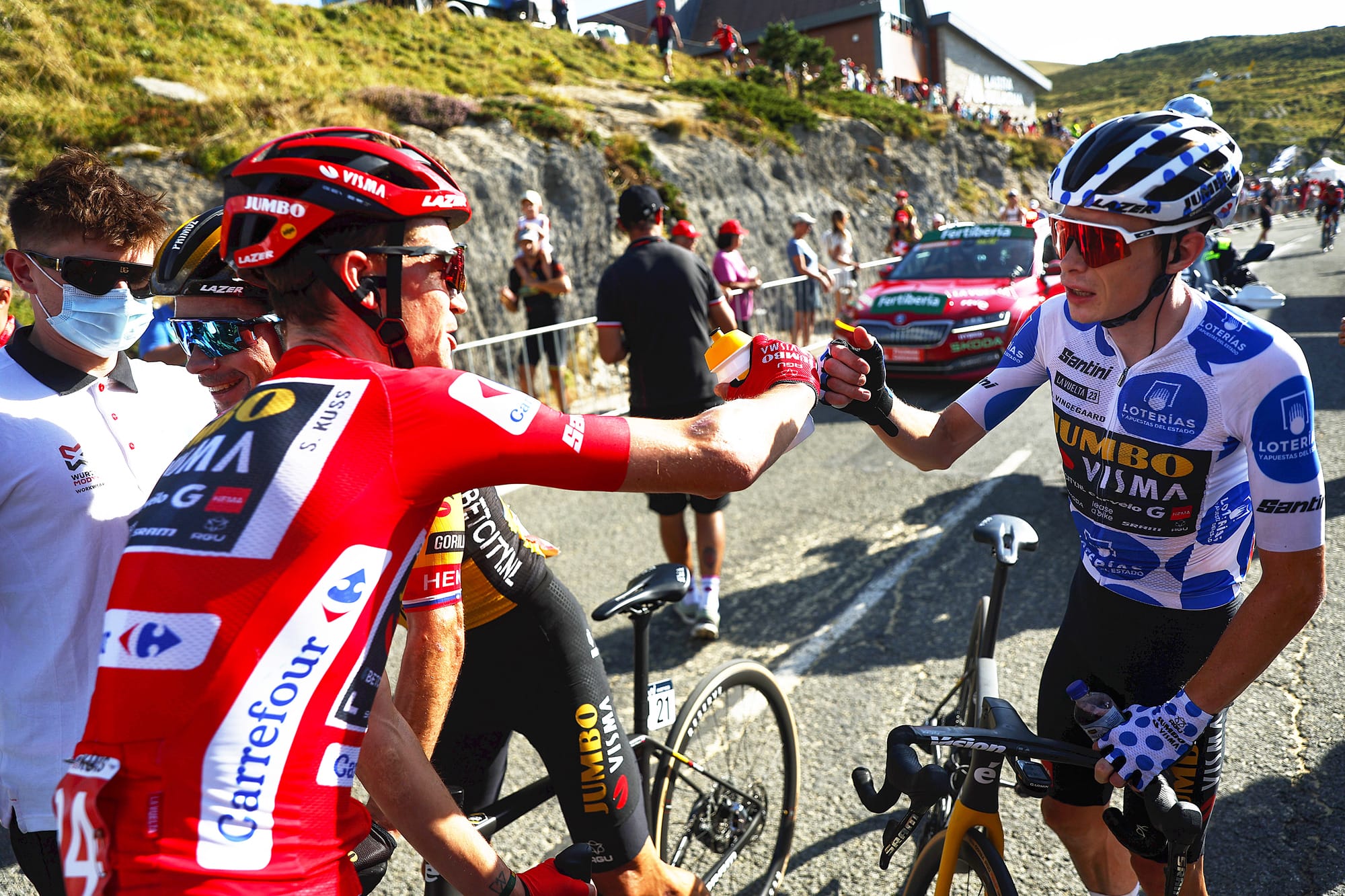 Riders celebrate at the end of a Vuelta a Espana stage. Witness scenes like these at the Vuelta a Espana 2024 with Team Visma Lease a Bike