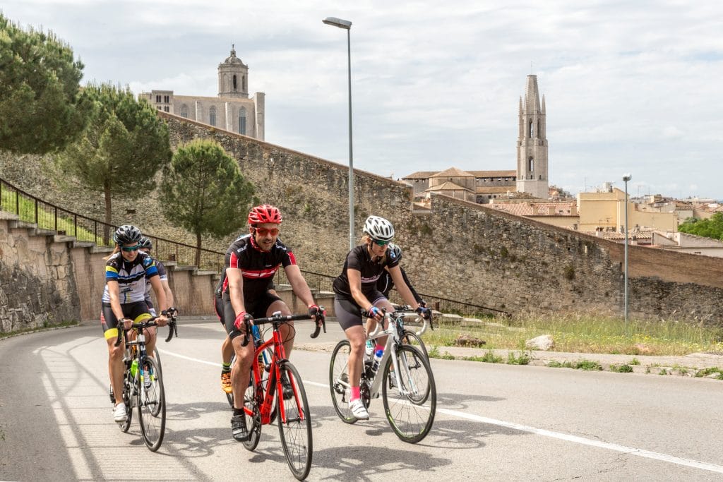 Cyclists enjoying a self-guided cycling holiday as they travel through Girona