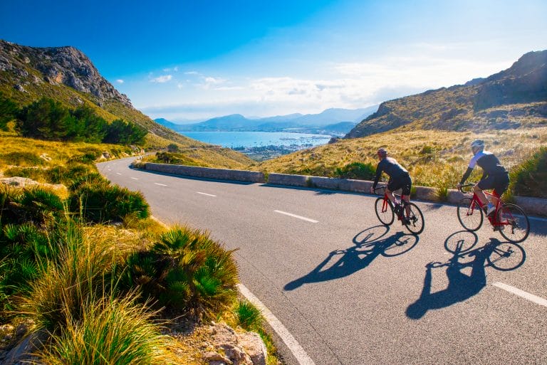 A pair of cyclists negotiate a gentle ascent on a self-guided road cycling trip in Mallorca