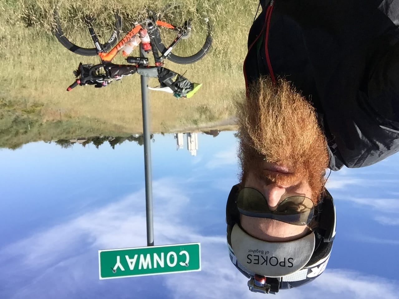 Ultra-endurance athlete Sean Conway poses in front of a sign for the town of Conway