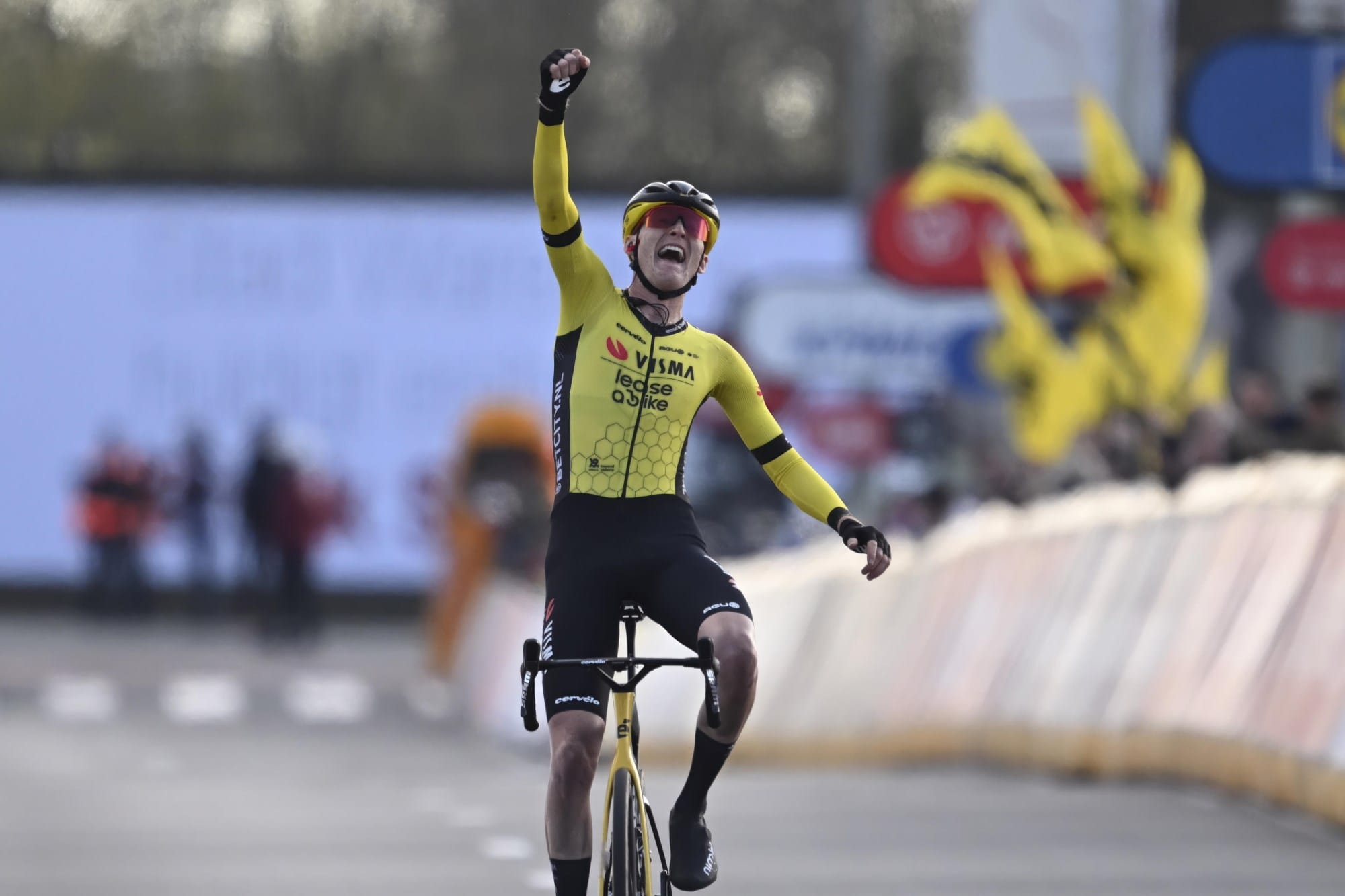 A Team Visma | Lease a Bike rider celebrates as they win the Spring Classic of Dwars door Vlaanderen