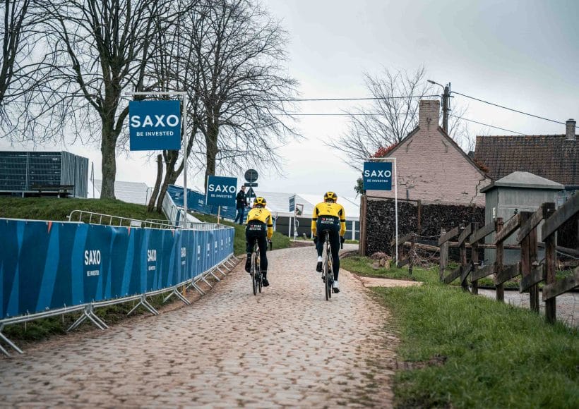 Team Visma | Lease a Bike riders passing along the cobbles during the E3 Saxo Classic
