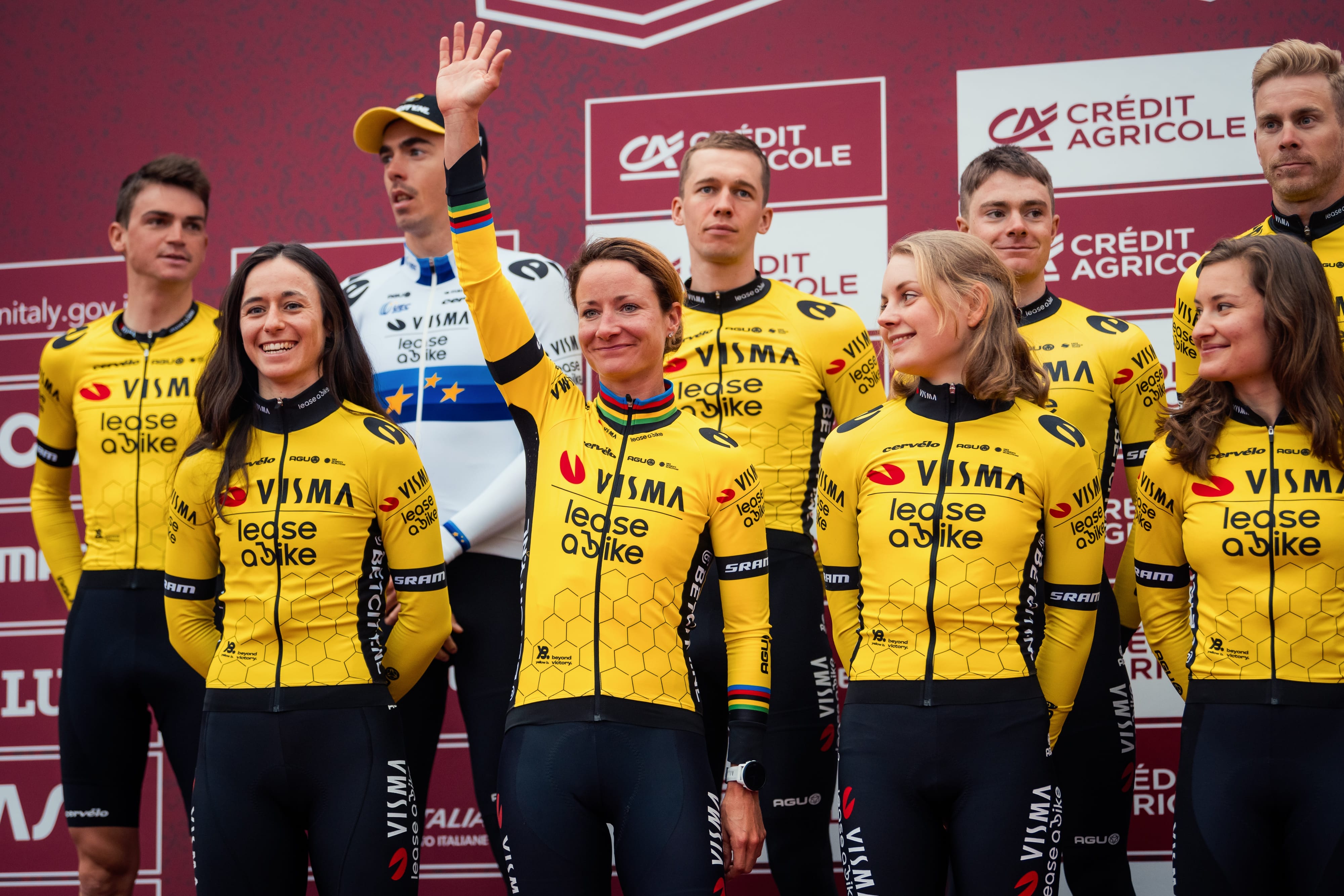 Riders pose on the podium at the Strade Bianche live 2025