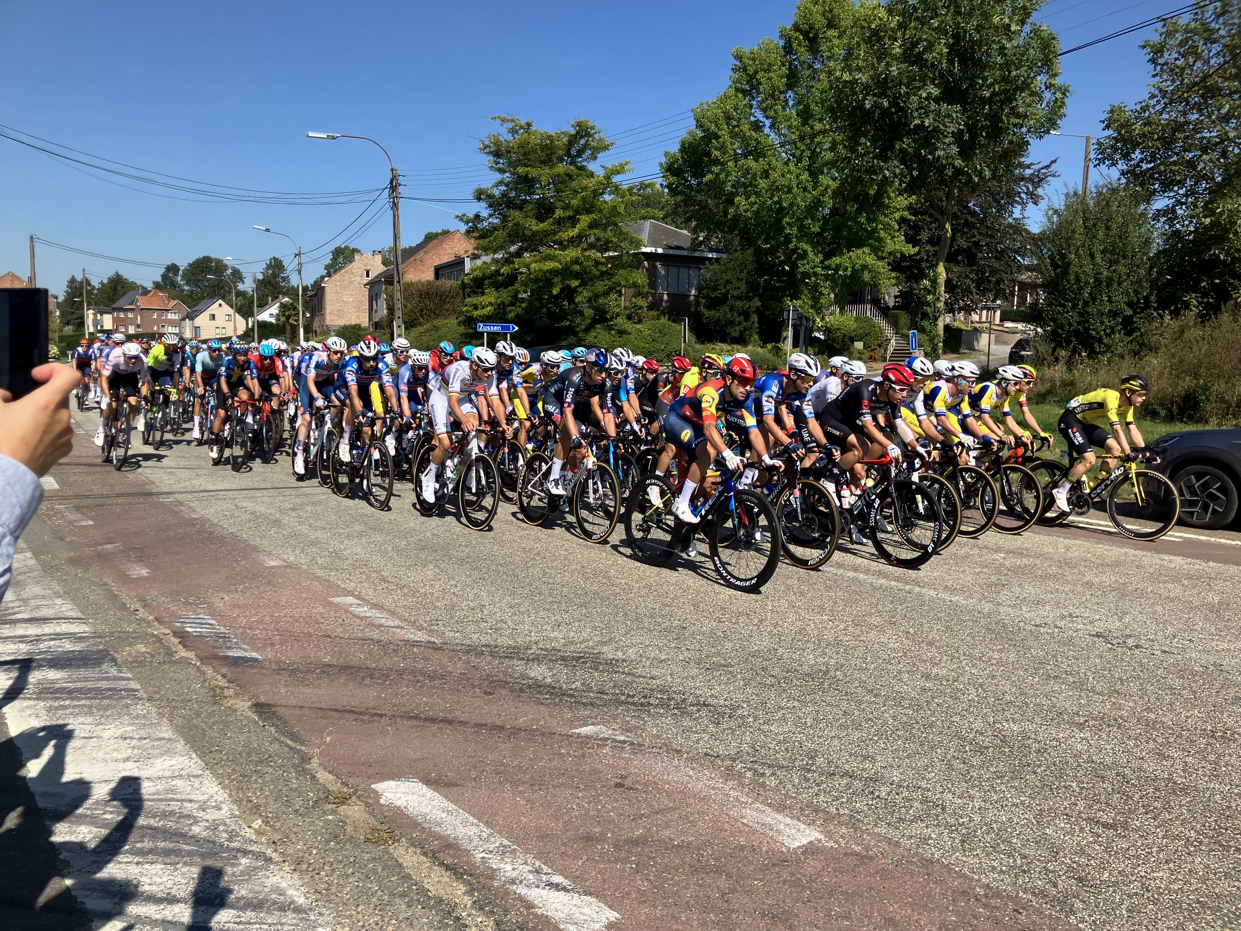 The peloton passes the camera during the Renewi Tour