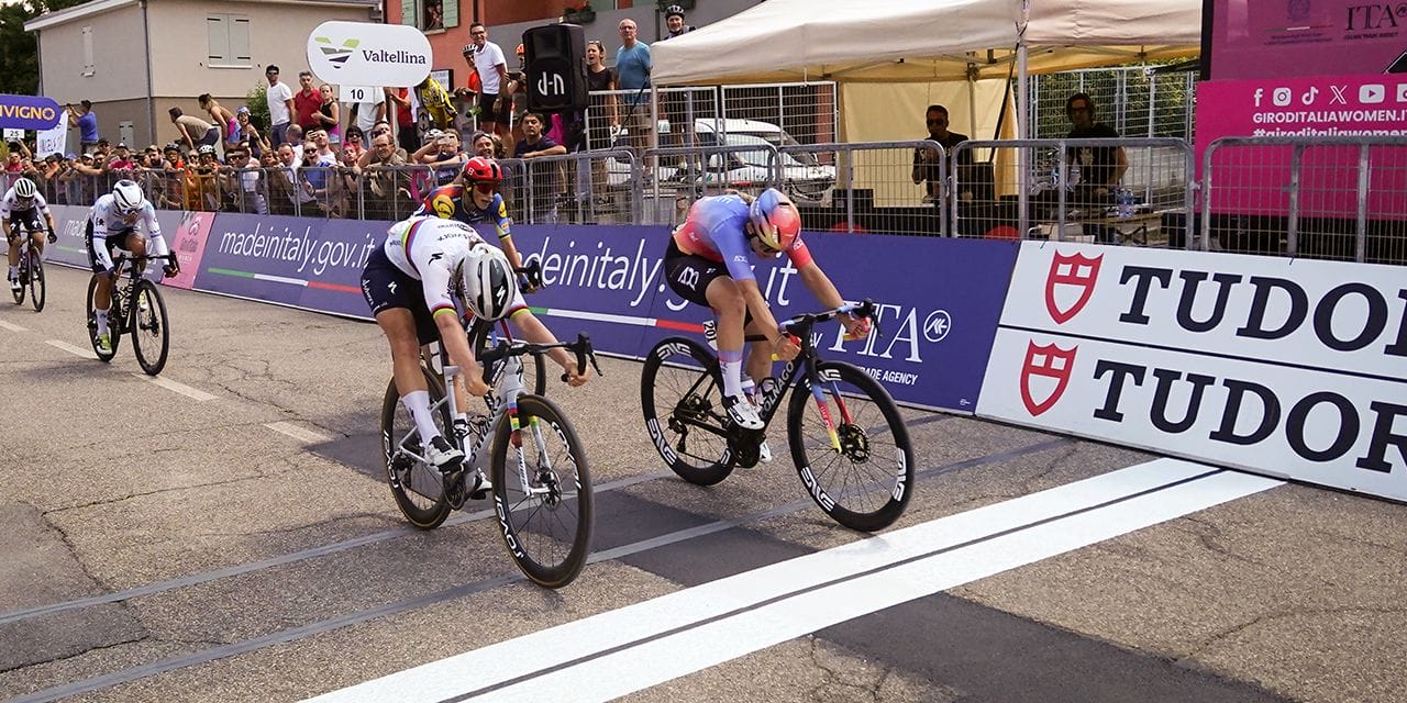 Two riders in a head-to-head sprint finish at the finish line of the Giro d'Italia Women
